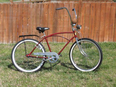 1994 Ford Bronco - Cruiser bicycle with chrome accents and whitewall tires sits on grass.