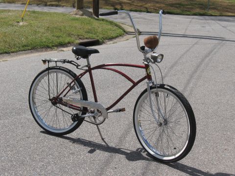 1994 Ford Bronco - A custom cruiser bicycle with a distinctive frame and chrome accents is shown from the side.