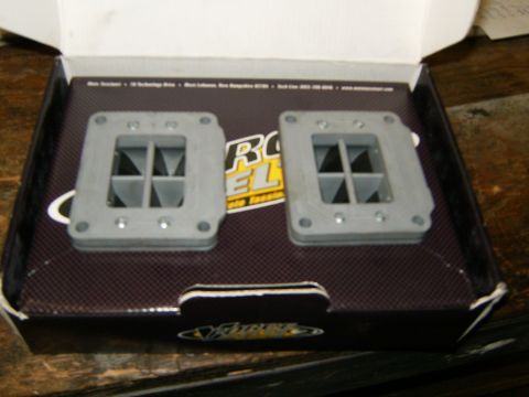 2000 Ford E350 - Two gray reed valve assemblies are shown inside their original packaging, which features a prominent 'Rox' logo.