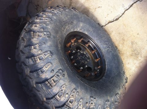 1996 Ford Bronco - This is a close-up view of a single off-road tire and wheel assembly.