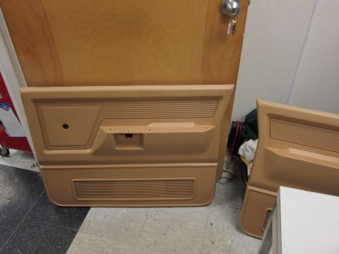 1987 Dodge 1500 - Two tan door panels are shown, likely for a truck, with one panel prominently displayed on the left.