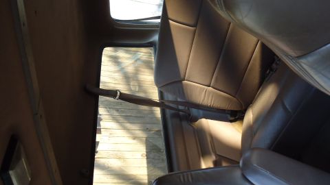 1996 Ford Bronco - Interior view of a vehicle's seats and side paneling.