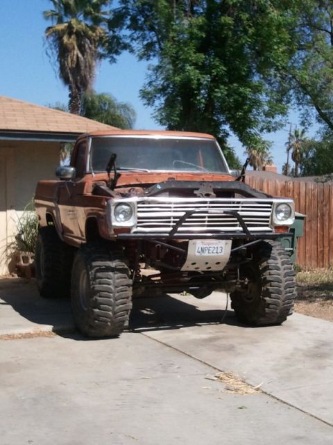 1969 Ford F-250 - This lifted Ford pickup truck features a custom front bumper and oversized tires.