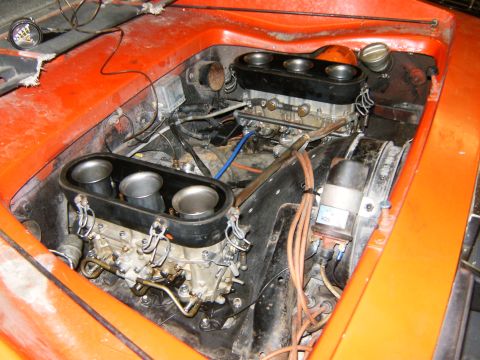 2000 Ford E350 - Close-up view of an engine bay dual Weber carburetors and intake trumpets, likely from a performance vehicle.