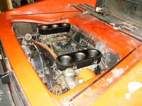 2000 Ford E350 - Engine bay with dual carburetors and air filters visible.