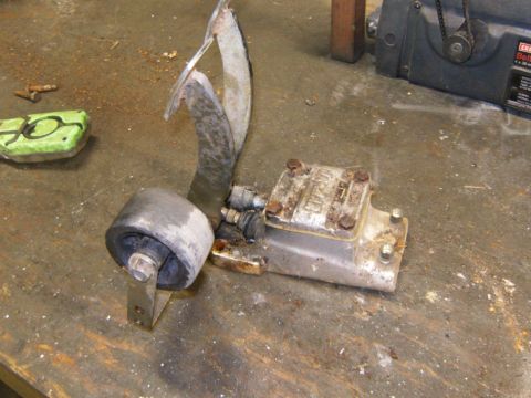 2000 Ford E350 - A close-up of a vehicle's brake pedal assembly, showing its mechanical components.