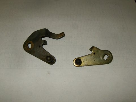2000 Ford E350 - Two metal levers are shown against a plain background, with a website URL visible at the bottom.