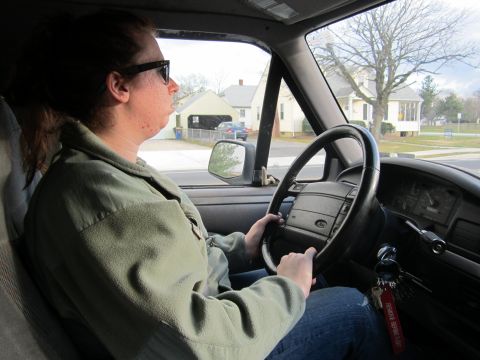 1994 Ford Bronco - A person drives a 1992 Ford Bronco, showing the interior dashboard and steering wheel.