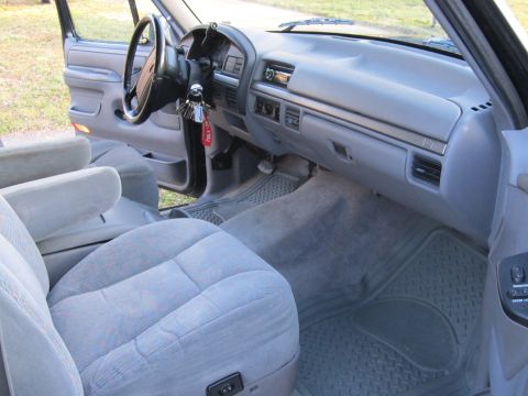 1994 Ford Bronco - Interior view of a 1994 Ford Bronco, the dashboard and front seating area.
