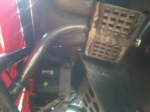 1966 Ford Bronco - Custom roll cage and pedal assembly visible in a vehicle's interior.