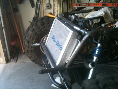 1966 Ford Bronco - Custom off-road buggy part detail showing radiator and large tire.