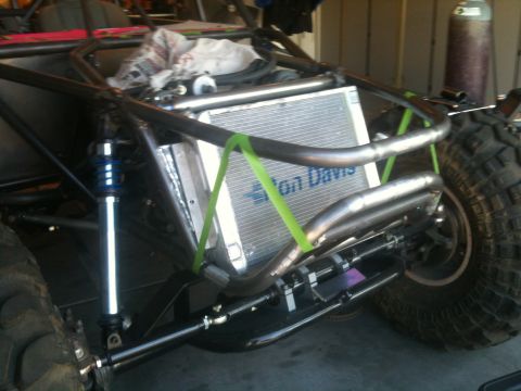1966 Ford Bronco - Rear view of a custom buggy, showing suspension components and a radiator with visible text.