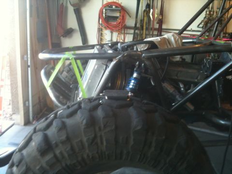 1966 Ford Bronco - This buggy's custom roll cage and suspension are visible in a workshop setting.