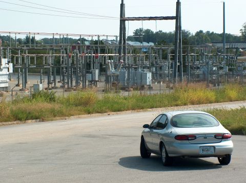 1998 Ford Taurus - Silver 1998 Ford Taurus parked near an electrical substation.