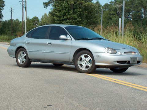1998 Ford Taurus - This 1998 Ford Taurus sedan is captured in a 3/4 front view on a paved road.
