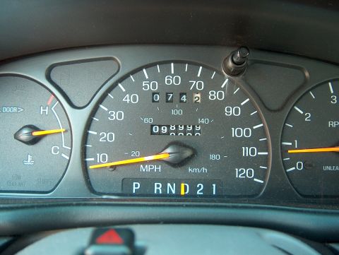 1998 Ford Taurus - Odometer shows 98,999 miles on the dashboard gauges.