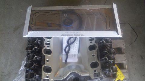 1978 Ford Bronco - A new engine gasket set is shown with cylinder heads, ready for installation.
