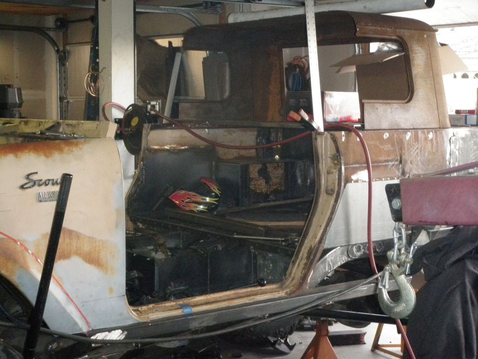 Interior of a rusty Scout with flames decal on floor