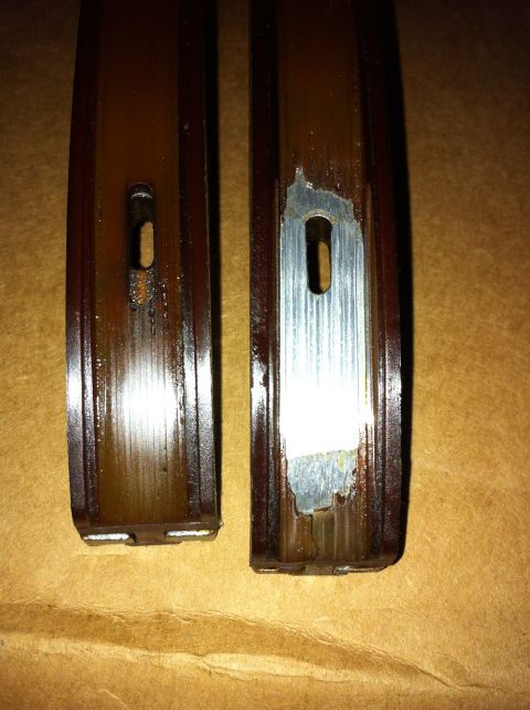 1998 Ford Crown Victoria - Close-up of two timing chain guides, one exhibiting wear and damage to its surface.