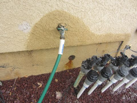 1968 Ford Mustang - Water stains on a wall indicate a leaky faucet and plumbing issues near irrigation valves.
