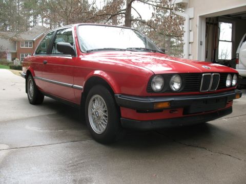 1986 BMW 3 Series - Red 1986 BMW 3 Series coupe with a black grille and chrome trim.