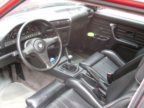 1986 BMW 3 Series - The interior of a 1986 BMW 3 Series features a black leather interior with a manual transmission and a clear view of the dashboard instrume…