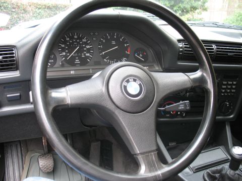 1986 BMW 3 Series - The interior of a 1986 BMW 3 Series shows the dashboard, steering wheel, and center console.