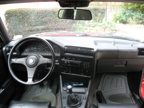 1986 BMW 3 Series - The interior of a 1986 BMW 3 Series shows the driver's side controls and dashboard.