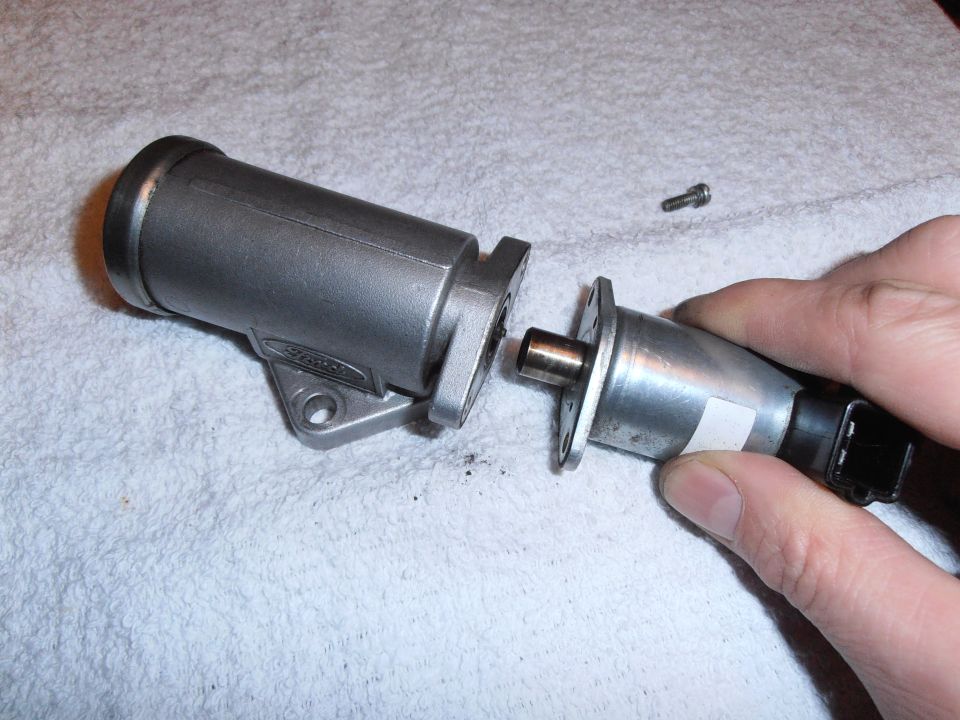 Idle air control valve assembly being held by hand