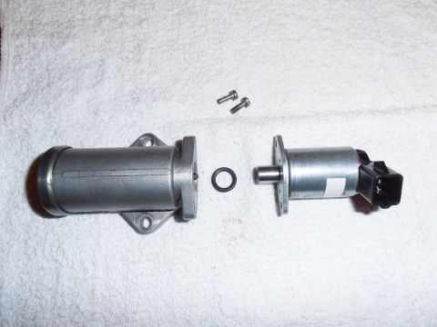 1990 Ford Bronco - Idle air control valve components laid out for inspection or repair.