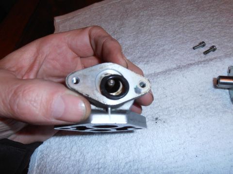 1990 Ford Bronco - A close-up of a disassembled automotive component, likely for maintenance or repair.