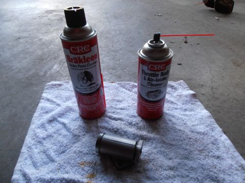 1990 Ford Bronco - CRC Brake Parts Cleaner and Throttle Body & Air-Intake Cleaner cans are shown with a small metal component.