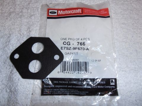 1990 Ford Bronco - A Motorcraft gasket is shown with its packaging, which includes part numbers and manufacturer information.