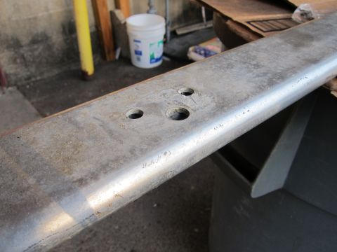 1991 Ford LTD Crown Victoria - Metal component with multiple holes, likely a bracket or support, showing signs of use.