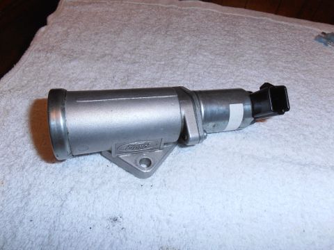 1990 Ford Bronco - A Ford Idle Air Control Valve is shown resting on a white towel.