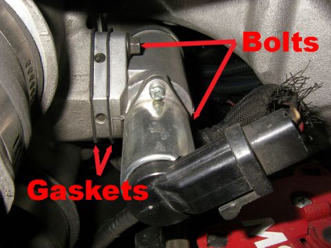 1990 Ford Bronco - Close-up of an engine component, with labels indicating bolts and gaskets.