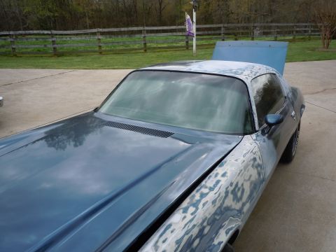 1973 Chevrolet Camaro - This 1973 Chevrolet Camaro is shown from a 3q-front angle with its hood open, revealing bodywork in progress.