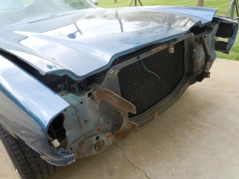 1973 Chevrolet Camaro - Front view of a 1973 Chevrolet Camaro with its grille removed and hood damaged.