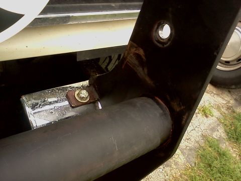 1989 Ford Bronco - Close-up of a black bull bar mounting bracket attached to a vehicle, showing a chrome accent piece and bolt.