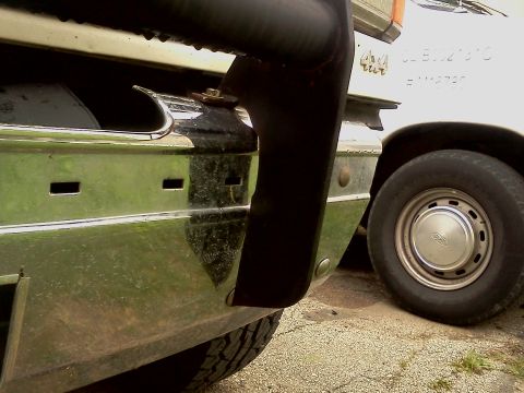 1989 Ford Bronco - Close-up of a 1989 Ford Bronco's front end, showing the bumper and a grille guard.