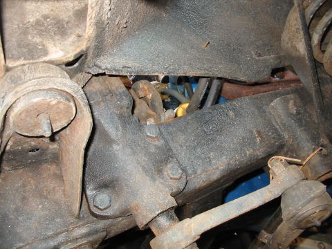 1969 Ford Bronco - Underside view of a vehicle's power steering system, showing mechanical components and hydraulic lines.