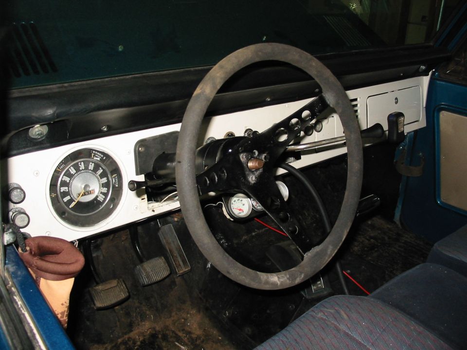 1969 Ford Bronco interior showing dashboard, steering wheel, and gauges