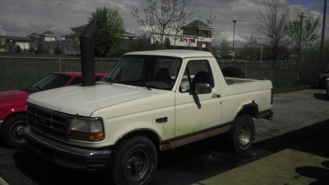 1989 Ford Bronco - This pickup truck has a snorkel exhaust pipe and appears to be a 1992 model, not a 1989 Bronco.