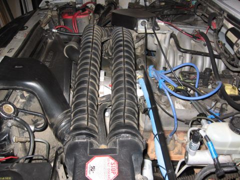 1995 Ford Bronco - A few earlier pics showed a black PVC tube going from air intake to intake on compressor, and that was swapped out for a goodyear hose as s…