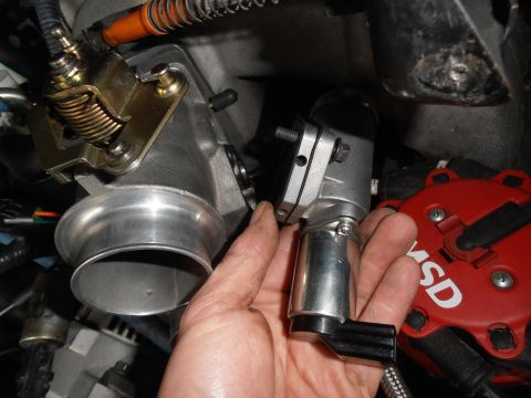 1990 Ford Bronco - Close-up of engine components including a throttle body, electronic sensor, and MSD distributor.