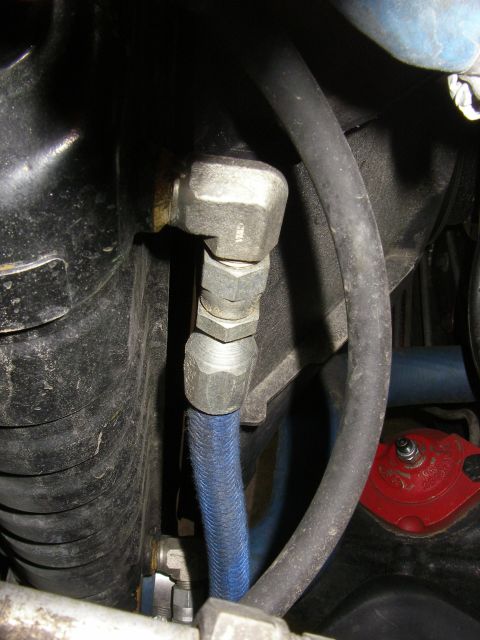1990 Ford Bronco - Hydraulic lines and fittings are visible in this close-up view.