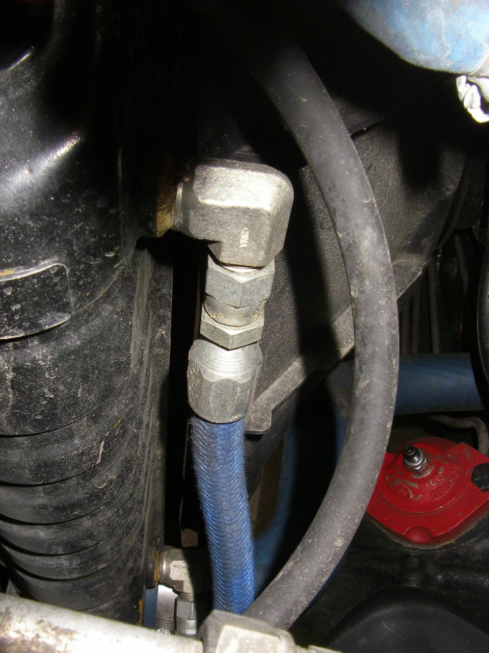 Close-up of hydraulic lines and fittings
