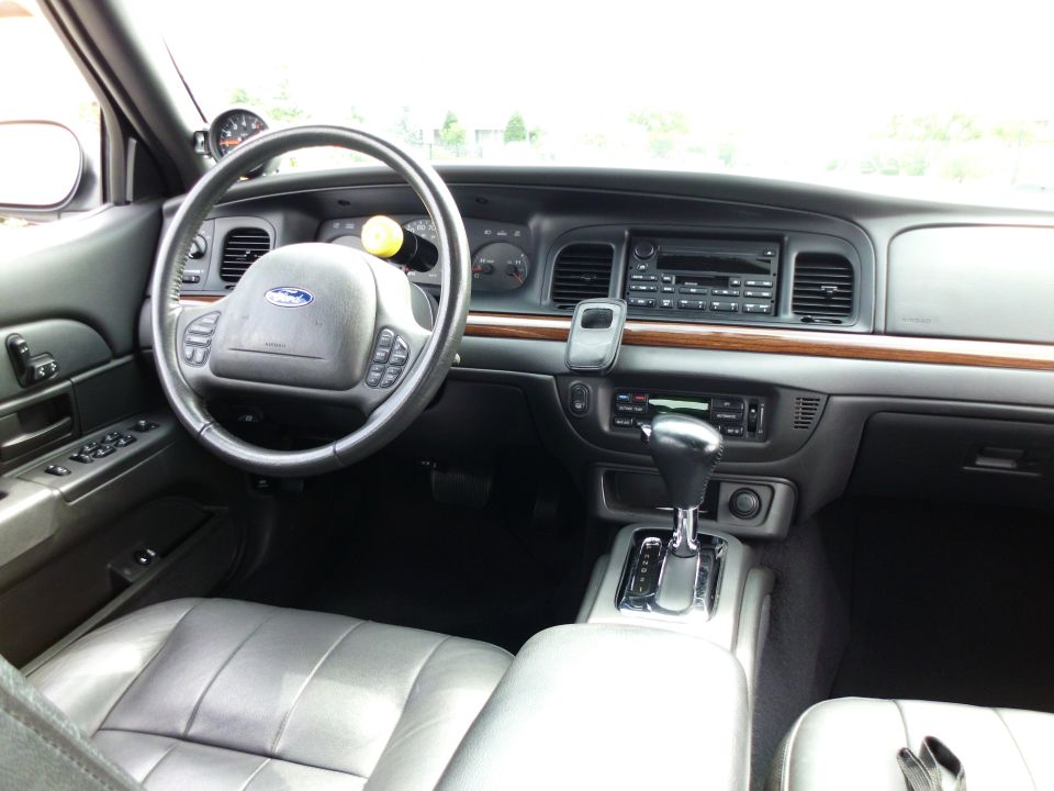 Ford Crown Victoria interior with wood trim, gray leather and column shifter