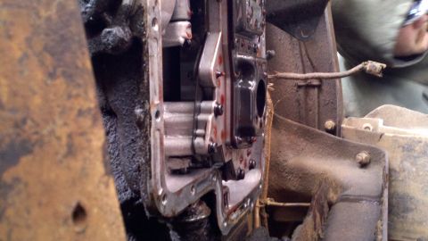 1978 Ford Bronco - Close-up view of internal transmission components, showing gears and fluid, during a repair process.