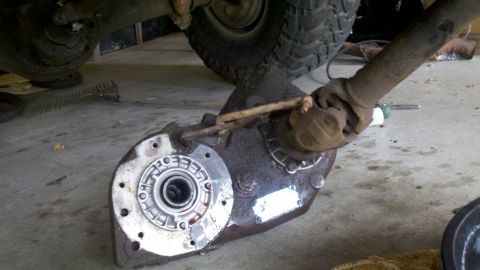 1978 Ford Bronco - Close-up of a vehicle's transfer case and driveshaft assembly, showing mechanical components.